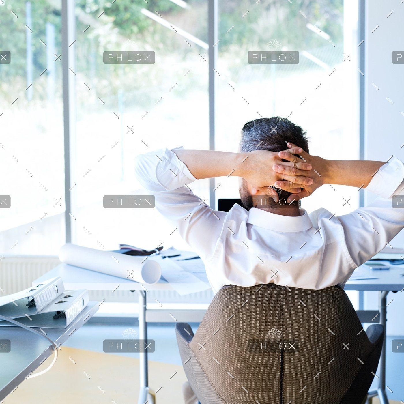 demo-attachment-135-Businessman-at-the-desk-in-his-office-resting.